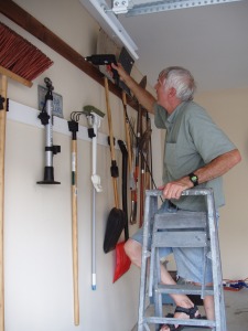 Dad hangs tools